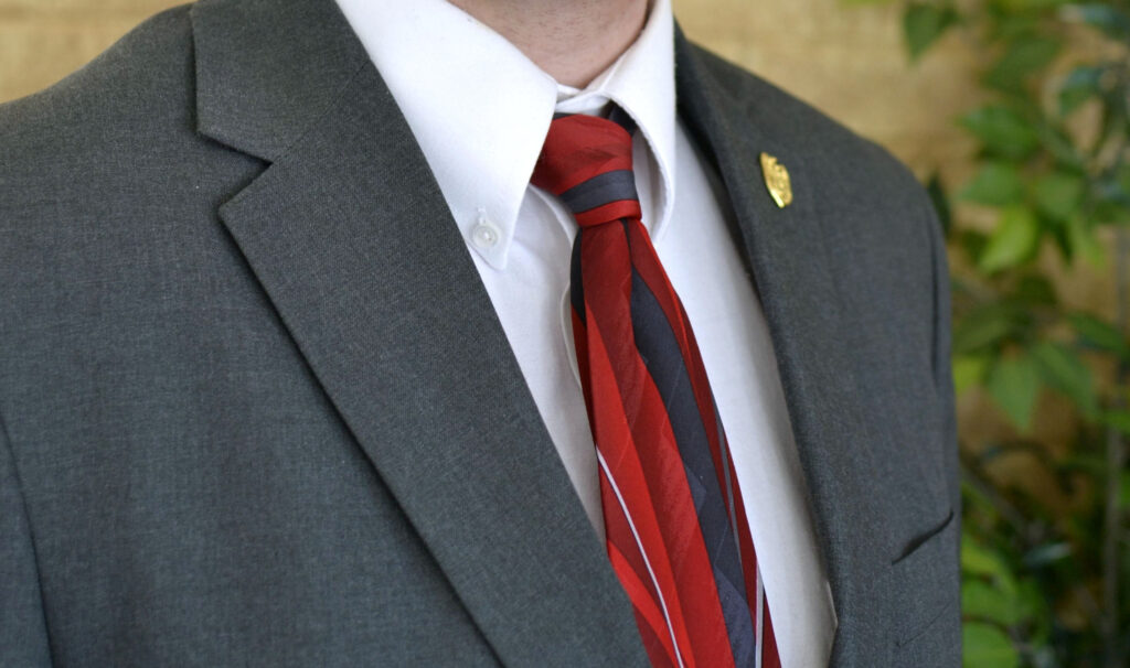 young man male teen wearing a gray suit and red ti utc