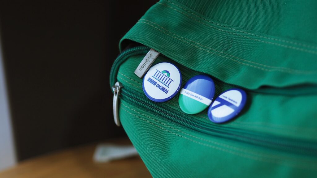 custom pin badges on backpack